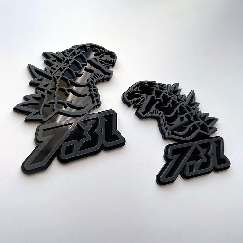 Godzilla 7.3L MEGAZILLA Performance 7.3L 3D Badge Grey vs Black Fender Badges Emblem
